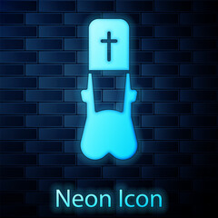 Poster - Glowing neon Priest icon isolated on brick wall background. Vector Illustration