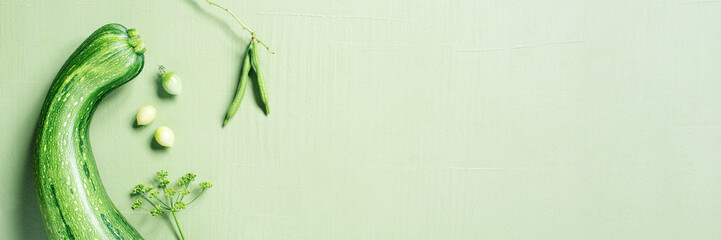 Healthy food concept, banner with fresh vegetables on the green table