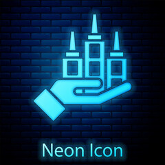 Poster - Glowing neon Skyscraper icon isolated on brick wall background. Metropolis architecture panoramic landscape. Vector