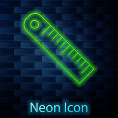 Glowing neon line Ruler icon isolated on brick wall background. Straightedge symbol. Vector