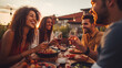 © Clipart Collectors - Group of young people having fun drinking red wine on balcony rooftop bbq dinner party - Happy multiracial friends eating barbecue food at restaurant terrace - Food and drink life style concept