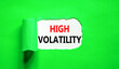 Leinwandbild Motiv High volatility symbol. Concept words High volatility on beautiful white paper. Beautiful green paper background. Business high volatility concept. Copy space.