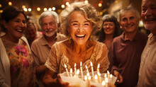 Radiant 60-year-old Woman Blowing Candles On Birthday Cake, Surrounded By Adoring Family. Embodying Joy, Love, And Unity In A Cherished Milestone Celebration.