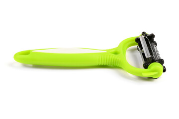 Universal green paring knife on white background. New paring knife duo slice. Side view.
