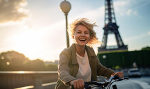 Cheerful Happy Young Woman Riding Bicycle In Paris Near The Eiffel Tower, Travel To Europe, Famous Popular Tourist Place In World.
