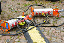 Plugged Sockets On Stone Pavement, Outdoor Event Temporary Mobile Power Supply And Distribution