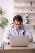 © Elnur - Young male doctor in telemedicine concept