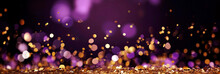 Abstract Violet And Gold Shiny Christmas Background With Bokeh. Holiday Bright Purple Blurred Backdrop With Golden Particles.