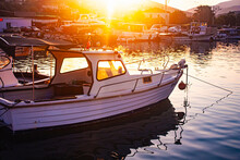 Photograph Of A Fishing Boat Waiting Moored In The Harbor Or On The Shore.