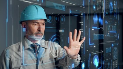 Aufkleber - Middle aged engineer watching futuristic graphical user interface.