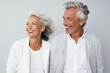 © radekcho - Beautiful gorgeous 50s mid age elderly senior model couple with grey hair laughing and smiling. Mature old man and woman close up portrait. Healthy face skin care beauty, skincare cosmetics, dental.
