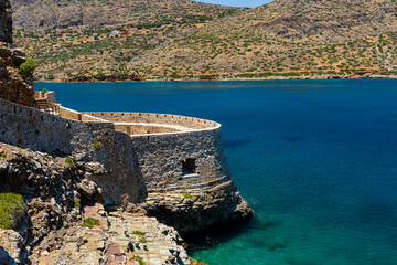 Canvas Print - Abandoned ruins of a former Venetian fortress and leper colony during a hot, dry summer (Spinalonga, Crete)
