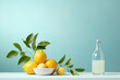 Still life minimalist bowl of lemons with lemonade on clean teal background
