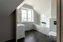 Bathroom In A Modern House With Black Ceramic Tiles On The Floor
