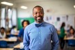 © Patrick - Portrait of smiling african american male teacher standing in classroom
