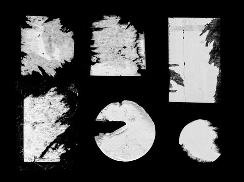 Set of Old Grunge Torn Ripped Paper Pieces and Round Stickers Isolated On Black Background. Urban Wall Poster Texture. High Quality Distressed Elements For Mixed Media Collage.