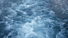 Close-up Of The Seething Water In The Sea Behind The Ship. Sea. A Splash Of Sea Waves Behind A Large Boat At Sea. Slow Movement.