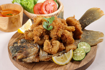 Wall Mural - Gurameh Saus Asam Manis. Fried Carp Fillet With Sauce. Deep Fried Carp Fillet.