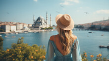 A Girl In A Blue Dress And A Straw Hat Looks At The City Of Istanbul, Turkey.