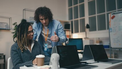African American woman talking with her supervisor, getting advice from boss