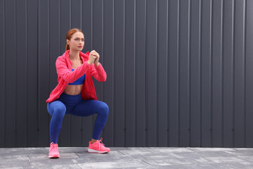 Sticker - Beautiful woman in gym clothes doing exercises on street, space for text