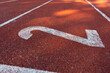 Running track lane number, starting line sign. Surface with lines and numbered lanes on a track and field athletics stadium. Sport running, jogging or walking runway.