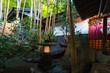 KUROKAWA ONSEN, JAPAN: ryokan garden with traditional stone lantern and bamboo grove, in one of Japan's most attractive hot spring towns, with luxury ryokan, bath houses, tourist shops and cafes