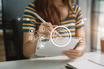 Women working with smart phone and laptop and digital tablet computer in office with digital marketing media in virtual icon.