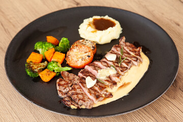 Wall Mural - Striploin angus steak with mashed potato and grilled vegetable