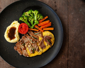 Wall Mural - Striploin angus steak with mashed potato and grilled vegetable