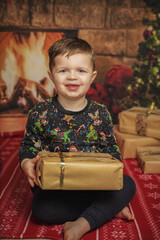 Wall Mural - happy little boy playing at christmas 