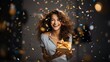 happy young woman with gift box and confetti at christmas party