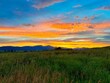 Colorful sunset over a field near Ennis, Montana