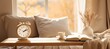 © Breezze - Cozy home interior in warm beige tones featuring an alarm clock on a wooden table, a book, a cup of tea, and a vase with dried field flowers. A comfortable blanket is nearby