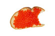 Artificial red caviar lies on a piece of bitten white bread. Isolation on a transparent background.