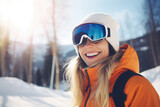 Beautiful happy young woman with sunglasses and ski equipment in ski resort, winter holiday concept.