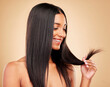 Hair care, wellness and portrait of woman in a studio with split ends for salon keratin treatment. Beauty, cosmetic and headshot of Indian female model with hairstyle isolated by a brown background.