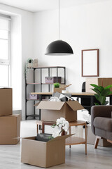 Poster - Interior of light office with cardboard boxes on moving day