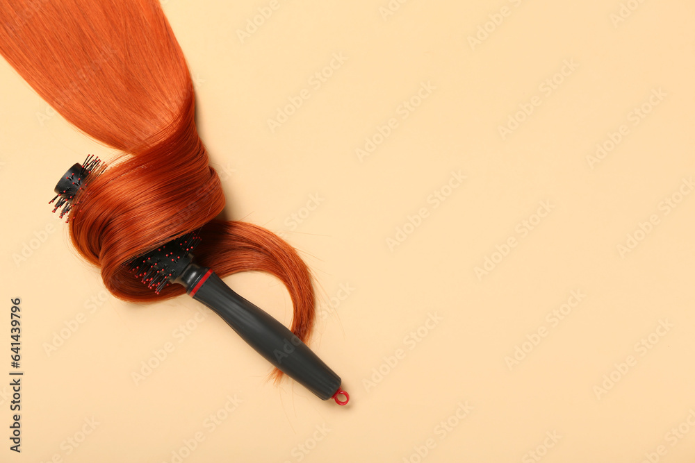 Ginger hair strand with brush on color background