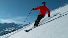 Super Slow Motion Of Off Piste Skier Running Down Hill. Sunny Day, Austria Alps, Europe. Filmed On High Speed Cinema Camera, 1000fps. Speed Ramp Effect.