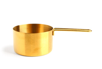 Golden measuring cup on white background