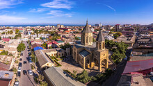 Aerial Drone View To Old Town Derbent, Caspian Sea And Armenian Church Of The Holy Saviour Surb Amenaprkich. Now Museum Of Carpet And Decorative And Applied Arts. Republic Of Dagestan, Russia