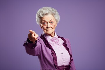 Old woman pointing her finger at camera