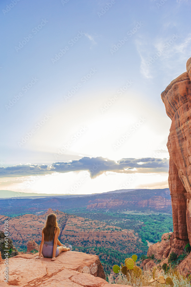 Little girl on the edge of a cliff at Cathedral Rock in Sedona, Arizona ...