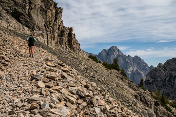 Poster - Woman Hikes Up Steep and Rocky Trail Toward Paintbrush Divide