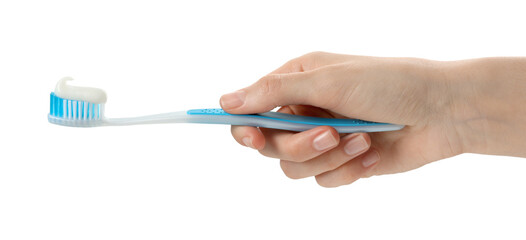 Woman holding toothbrush with paste on white background, closeup