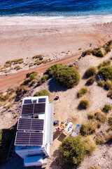 Wall Mural - Caravan with tilt solar panels on roof. Aerial view.