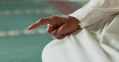 Poster - Islam, floor and closeup of a pointing finger or person at a mosque for praying, hajj or support. Muslim, hope and hand of a man for a prayer, gesture or worship for respect, religion or trust