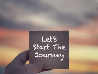 Wall Mural - Motivational and inspirational wording. Let’s Start The Journey written on a notepad. With blurred styled background.