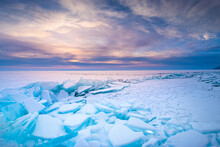 Blue Ice On Baikal Lake At Sunrise. Khoboy Cape Of Olkhon Island, Baikal, Siberia, Russia.